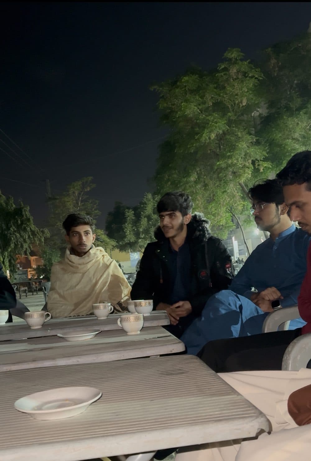 Members talking over tea at a weekly gathering